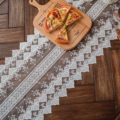 Elegant and refined lace table runner with intricate embroidery and hollowed-out patterns, perfect for sophisticated dining experiences