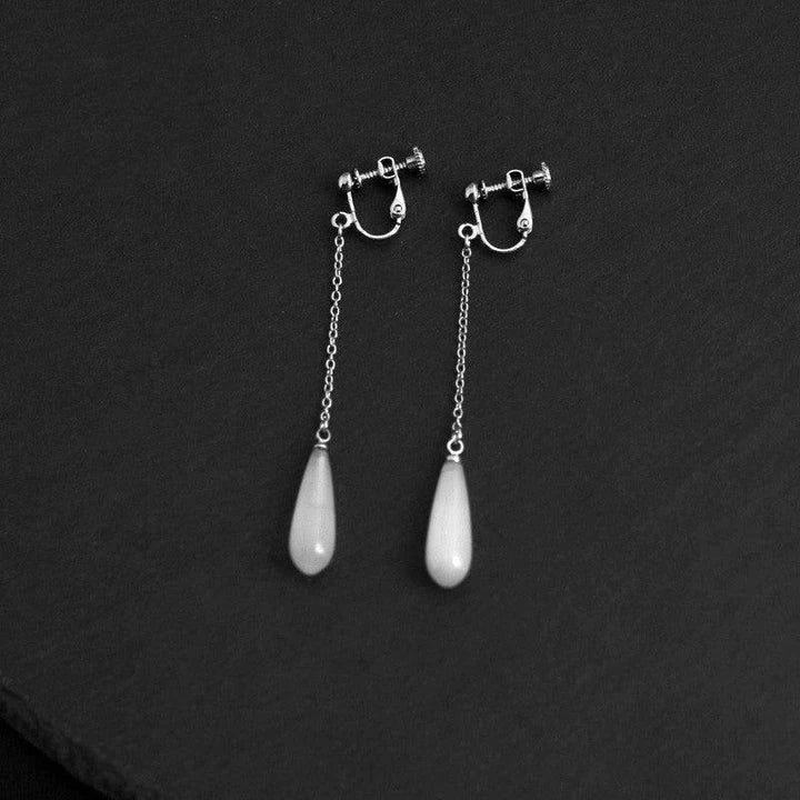 925 Sterling Silver Opal Drop Earrings with a sleek and sophisticated design, perfect for adding a touch of elegance to any outfit.