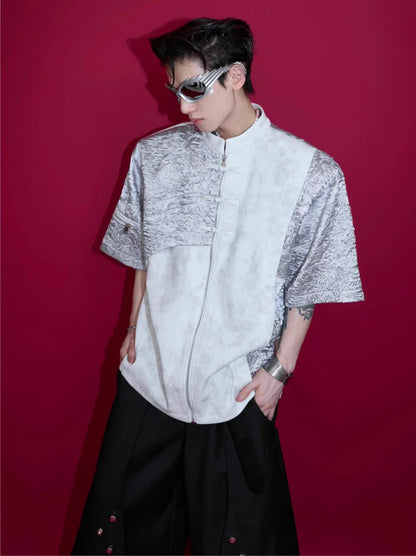 A black and white t-shirt with padded shoulders and a buckle design, offering a relaxed and comfortable fit.