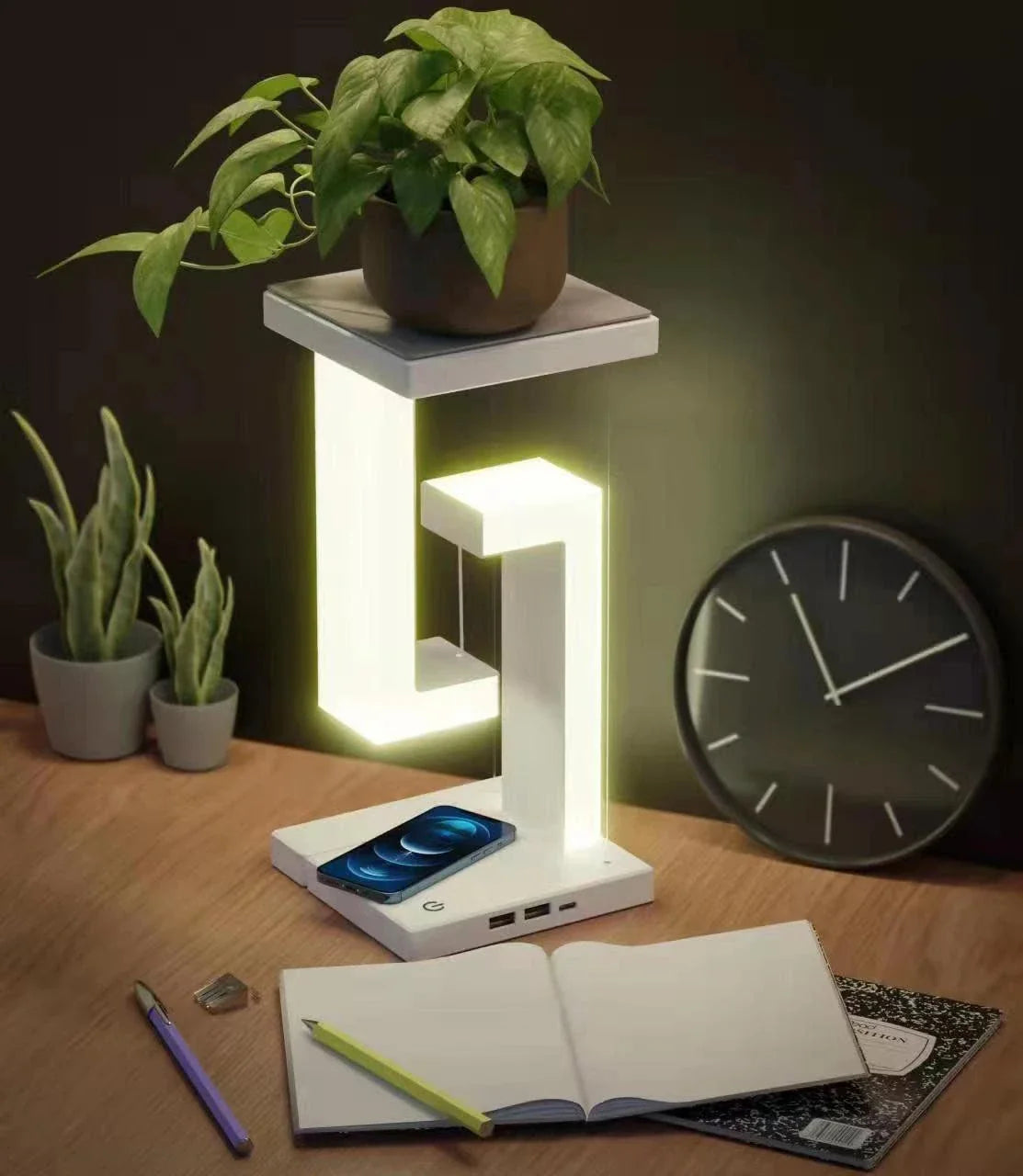 A modern, levitating desk lamp with wireless charging capabilities for smartphones
