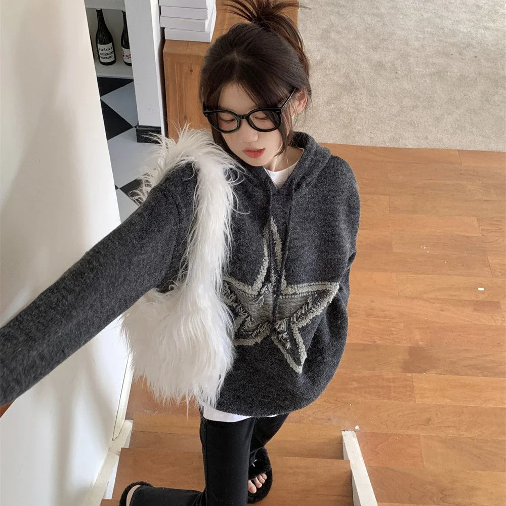 A cozy, vintage-inspired sweater with a five-pointed star design, made in America with premium polyester for lasting comfort and style.