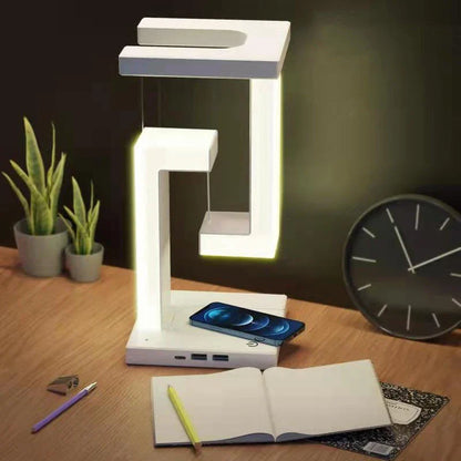 A modern, levitating desk lamp with wireless charging capabilities for smartphones