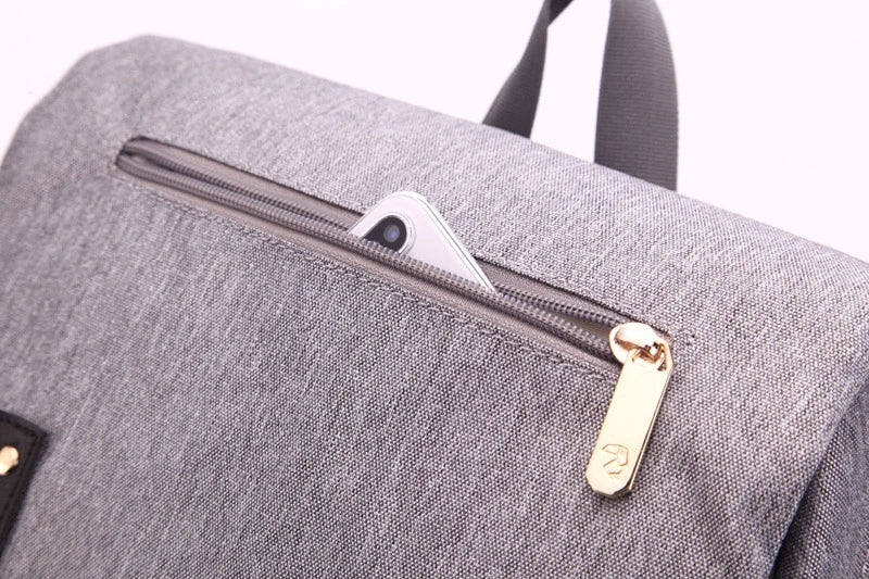 Premium diaper backpack with insulated pockets, stroller attachment, and USB charging port