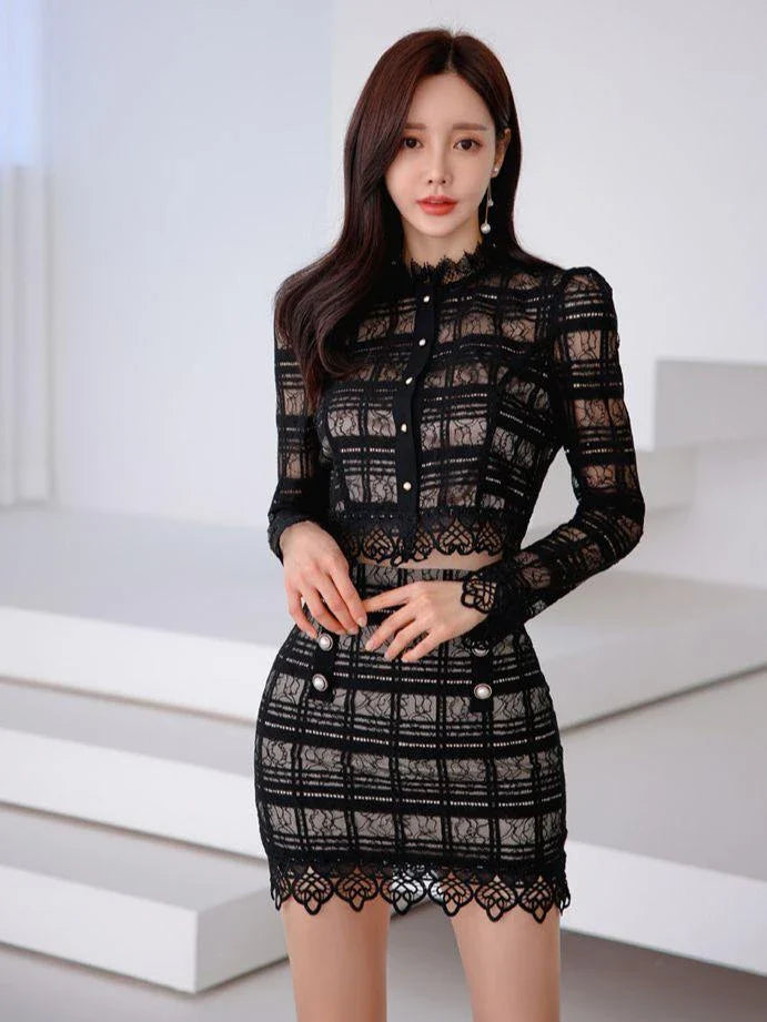 Elegant lace two-piece suit with Chanel-inspired design, featuring a long-sleeved top and short skirt in a sophisticated white color.