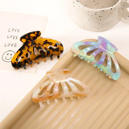 Stylish geometric hollow stripes barrettes in beige color, a fashionable hair accessory for women and girls