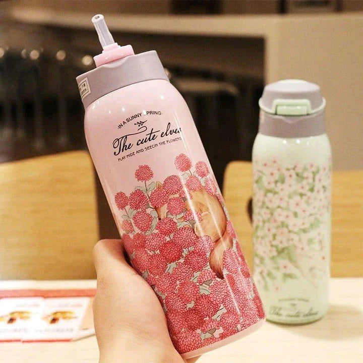 Stylish floral double-wall stainless steel water bottle with a convenient straw lid, maintaining temperature for up to 12 hours.
