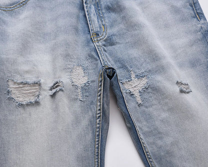 Premium distressed denim jeans with ripped detailing, perfect for casual streetwear style