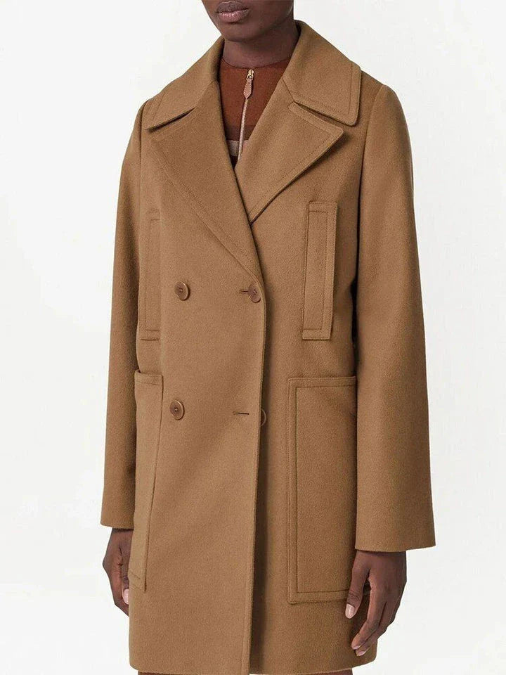 A stylish, mid-length double-breasted overcoat in a rich brown color, designed with a turn-down collar and practical patch pockets for a polished, versatile look.