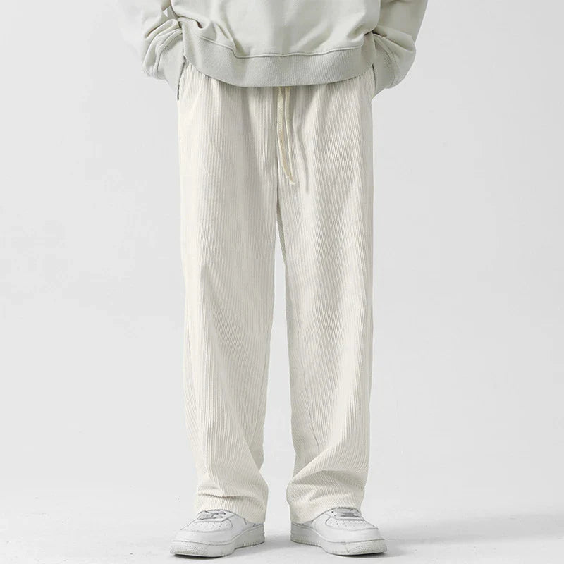 Fleece-lined corduroy pants in various colors, featuring a relaxed, straight-leg fit for all-day comfort and warmth.