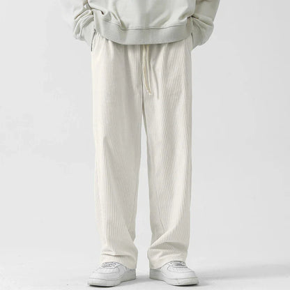 Fleece-lined corduroy pants in various colors, featuring a relaxed, straight-leg fit for all-day comfort and warmth.
