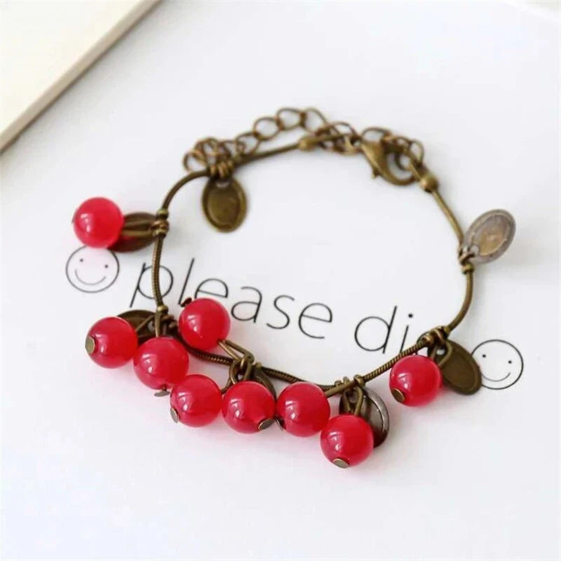 Boho vintage-inspired cherry coin bracelet with adjustable lobster-claw clasp, perfect for girls' summer fashion
