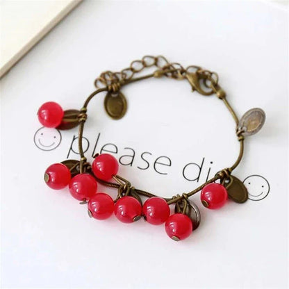 Boho vintage-inspired cherry coin bracelet with adjustable lobster-claw clasp, perfect for girls' summer fashion