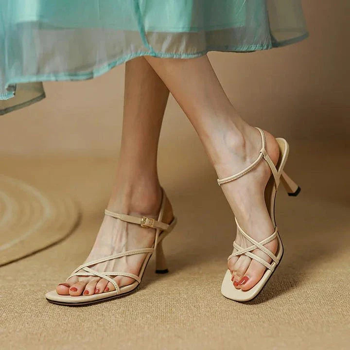 Elegant square high heel sandals for women in beige color with a stylish buckle closure and a cushioned insole for comfort