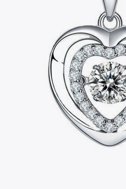 Captivating moissanite heart pendant necklace in sterling silver with a 0.5-carat center stone and sparkling accent stones