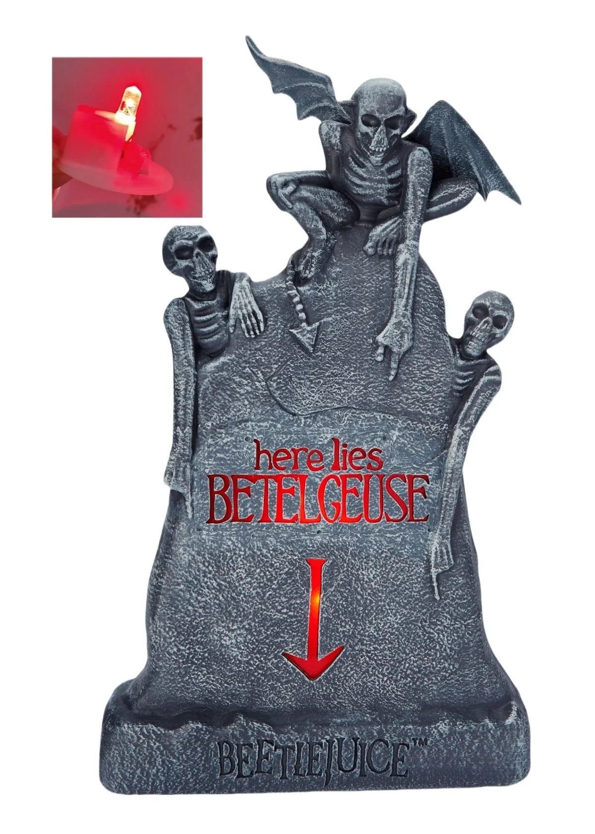Glowing ghost skull tombstone decor with a spooky, otherworldly glow for Halloween
