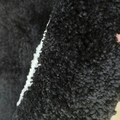 A round, soft rug with a spooky 8 ball design, perfect for adding a unique, eerie accent to any room.