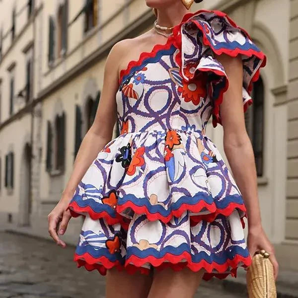 Fashionable sleeveless mini dress with ruffled details and vibrant floral print