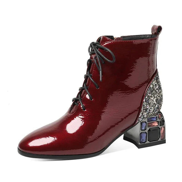 Elegant patent leather pumps with rhinestone embellishments and thick, high heels