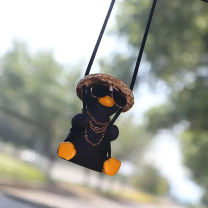 Cute swinging duck car pendant with a guitar and coke-themed design, adding a touch of personality to your vehicle
