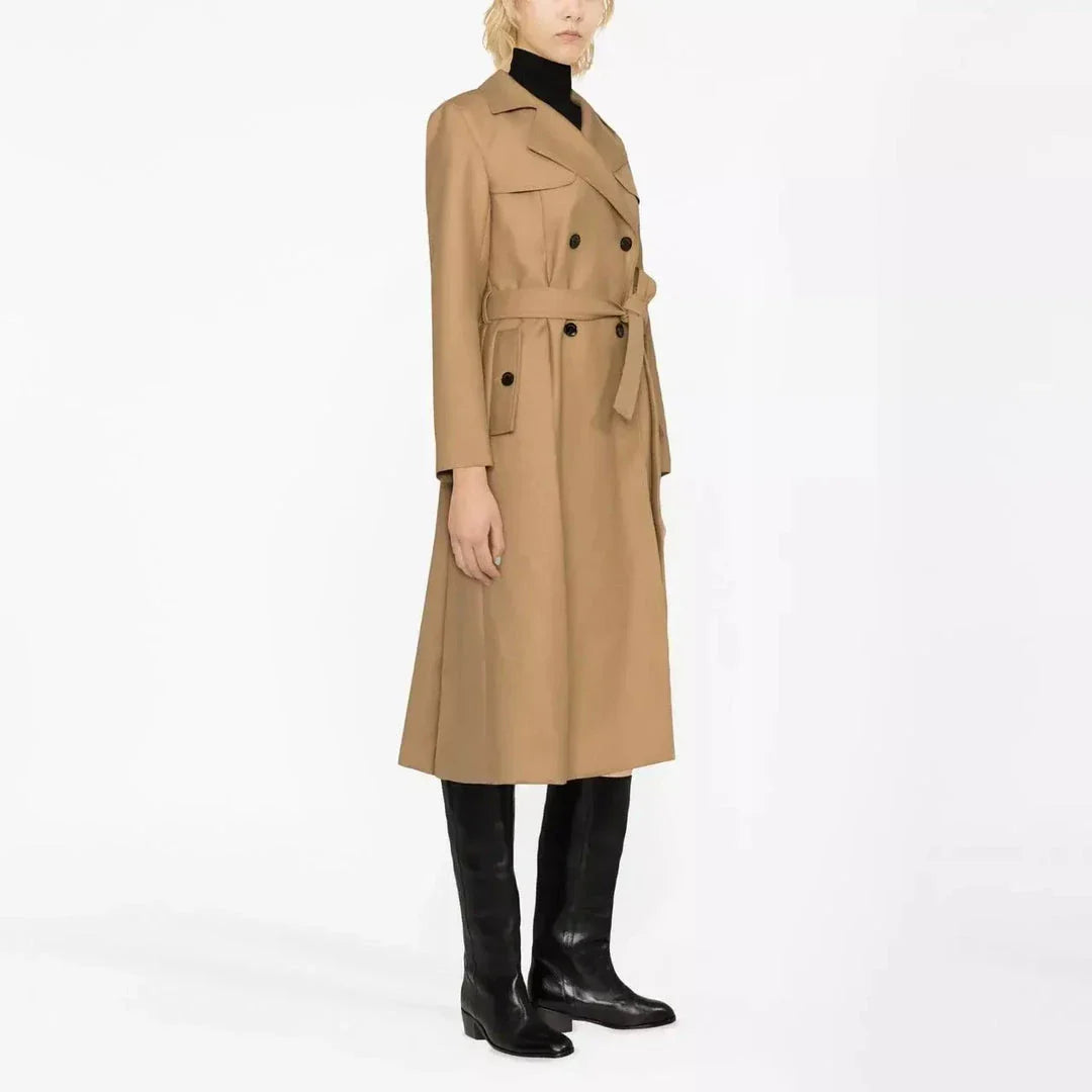 Elegant double-breasted women's trench coat in beige color with sash and pockets for a timeless, versatile style