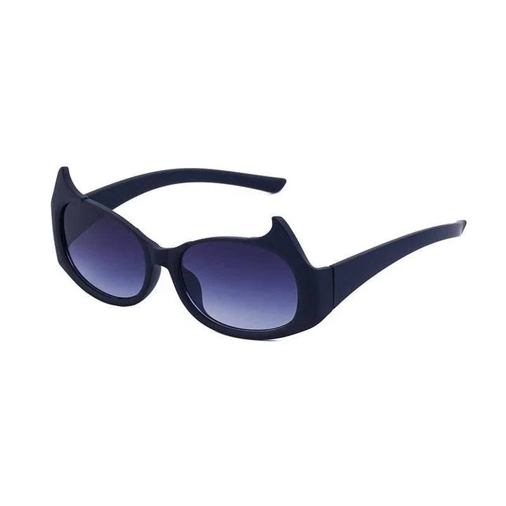Stylish cat-eye sunglasses with oversized frames, semi-rimless design, and punk-inspired detailing for a timeless, glamorous look