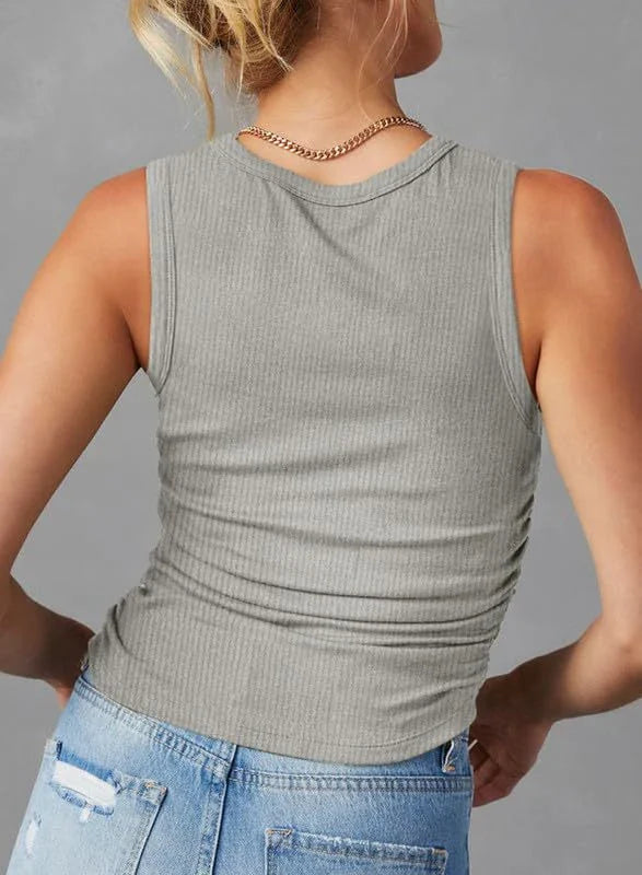 A sleeveless ribbed knit tank top for women in a variety of colors and sizes, featuring a crew neck design and pleated details for a stylish, casual look.