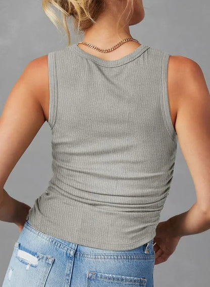 A sleeveless ribbed knit tank top for women in a variety of colors and sizes, featuring a crew neck design and pleated details for a stylish, casual look.