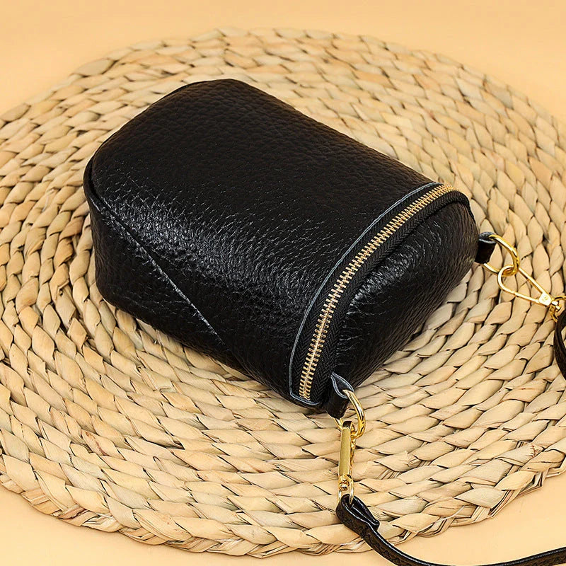 Premium leather crossbody bag with adjustable strap, multiple pockets, and sleek Korean-inspired style