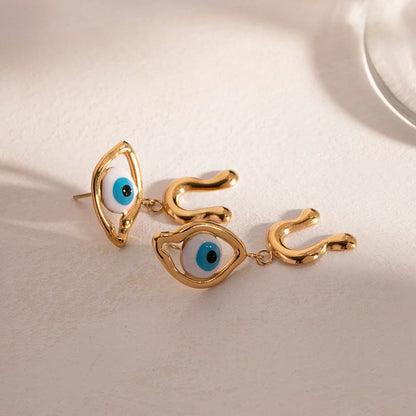 Pair of 18K gold plated stainless steel asymmetrical devil's eye earrings with a dripping oil finish