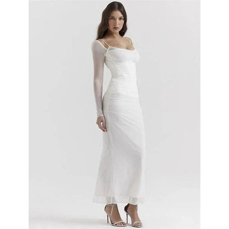 Elegant sheer long sleeve maxi dress with a backless design and H-profile silhouette for a sophisticated and alluring evening look.
