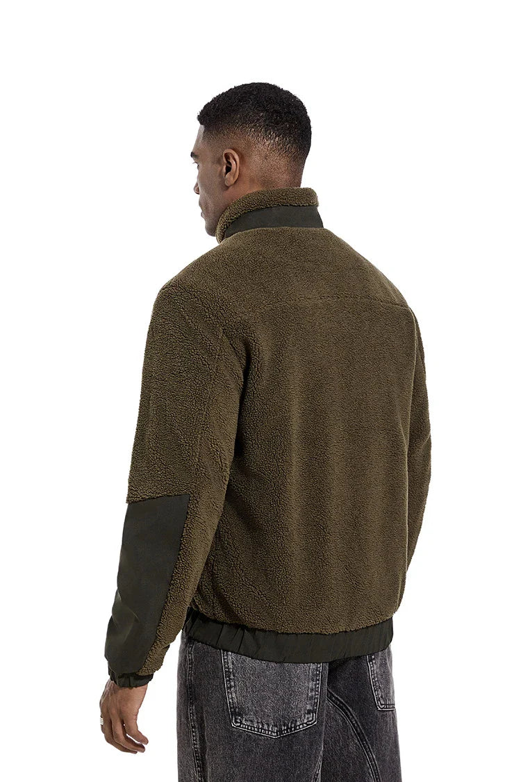 A cozy and stylish men's fleece jacket with a standing collar and convenient side pockets, available in a range of classic colors.