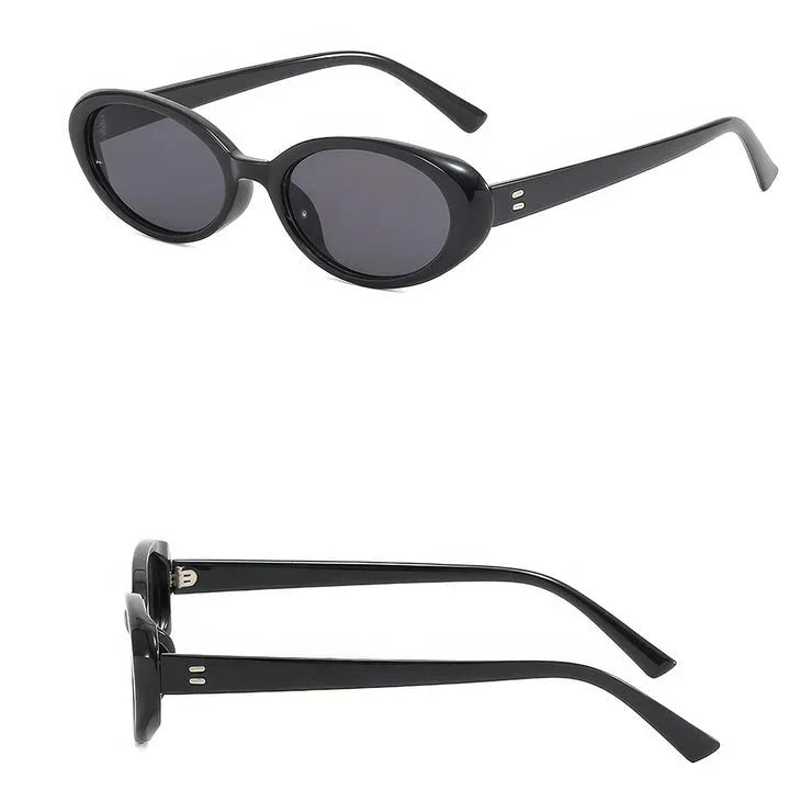 Chic oval sunglasses with white grey acetate frames and polycarbonate lenses, designed for fashionable women to shield their eyes from UV rays in style.