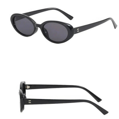 Chic oval sunglasses with white grey acetate frames and polycarbonate lenses, designed for fashionable women to shield their eyes from UV rays in style.