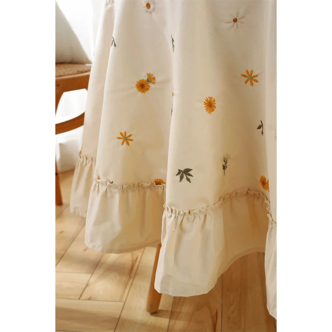 Elegant cotton tablecloth with apricot embroidery and lotus leaf edge, perfect for dining decor