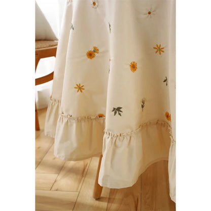 Elegant cotton tablecloth with apricot embroidery and lotus leaf edge, perfect for dining decor