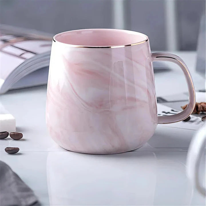 Elegant marble pattern ceramic mug with a gold rim, perfect for coffee, tea, and other hot and cold beverages