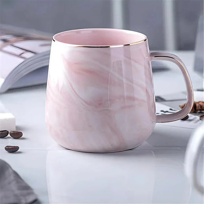 Elegant marble pattern ceramic mug with a gold rim, perfect for coffee, tea, and other hot and cold beverages