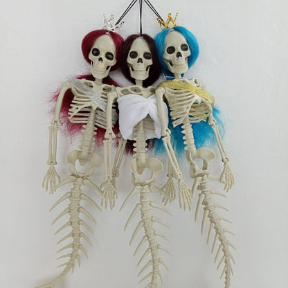 Mermaid bone pendant in various colors, including brown, dark purple, burgundy, and lake blue, hanging outdoors for Halloween decoration