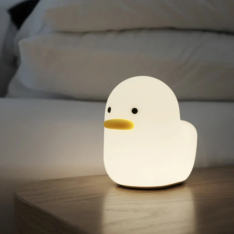 Cute duck-shaped LED night light with silicone and ABS construction, USB charging, and adjustable brightness