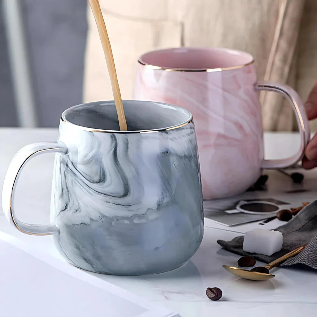 Elegant marble pattern ceramic mug with a gold rim, perfect for coffee, tea, and other hot and cold beverages