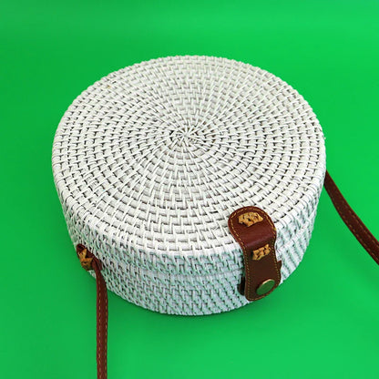 Trendy rattan shoulder bag with a vintage-inspired design, featuring a roomy interior and adjustable strap for versatile use.