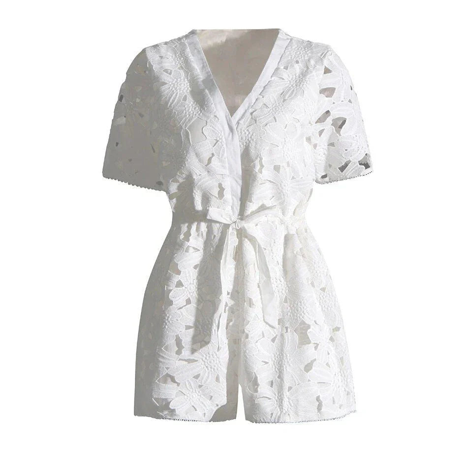 Chic embroidered hollow-out summer playsuit with a V-neck, high waistline, and short sleeves for a stylish and comfortable vacation or casual look.