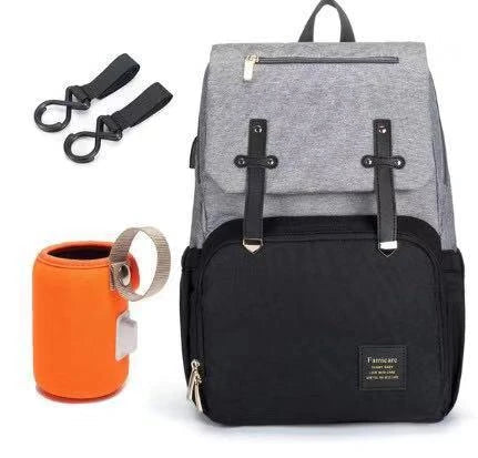 Premium diaper backpack with insulated pockets, stroller attachment, and USB charging port