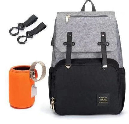 Premium diaper backpack with insulated pockets, stroller attachment, and USB charging port