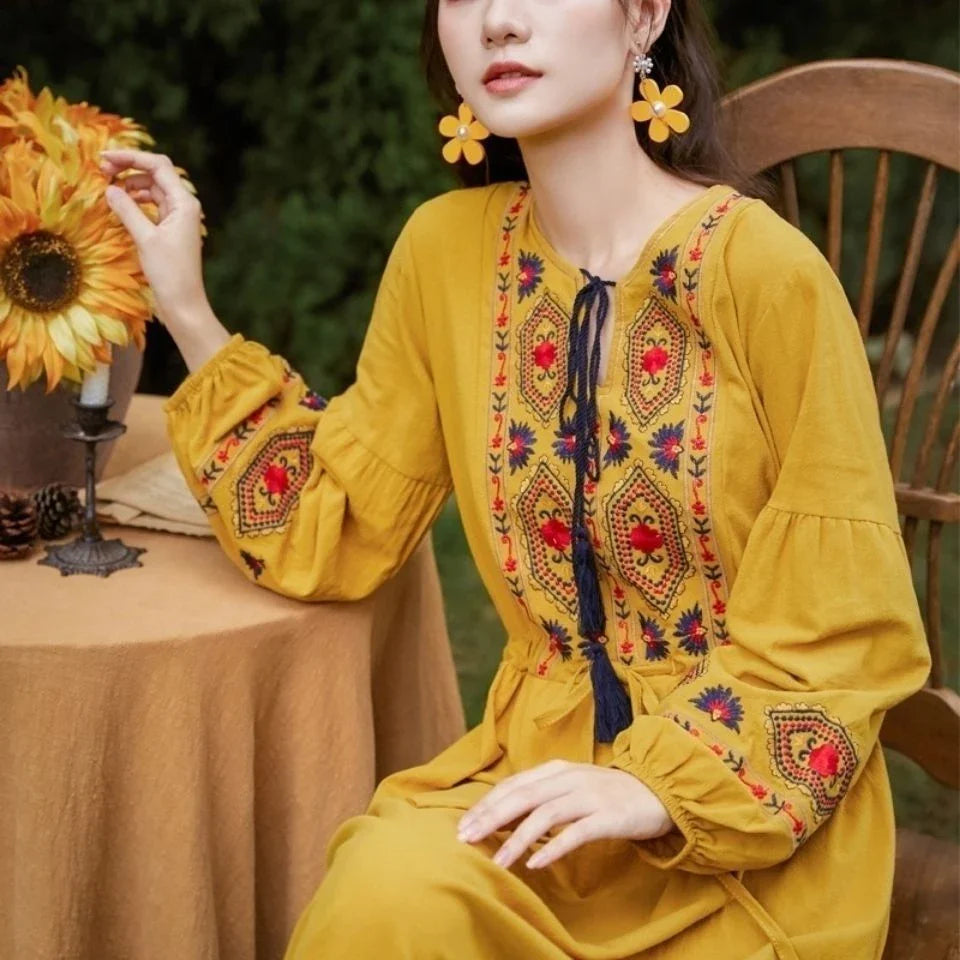 Elegant embroidered cotton-linen dress with tassels, featuring a waist-cinching A-line silhouette in vibrant colors