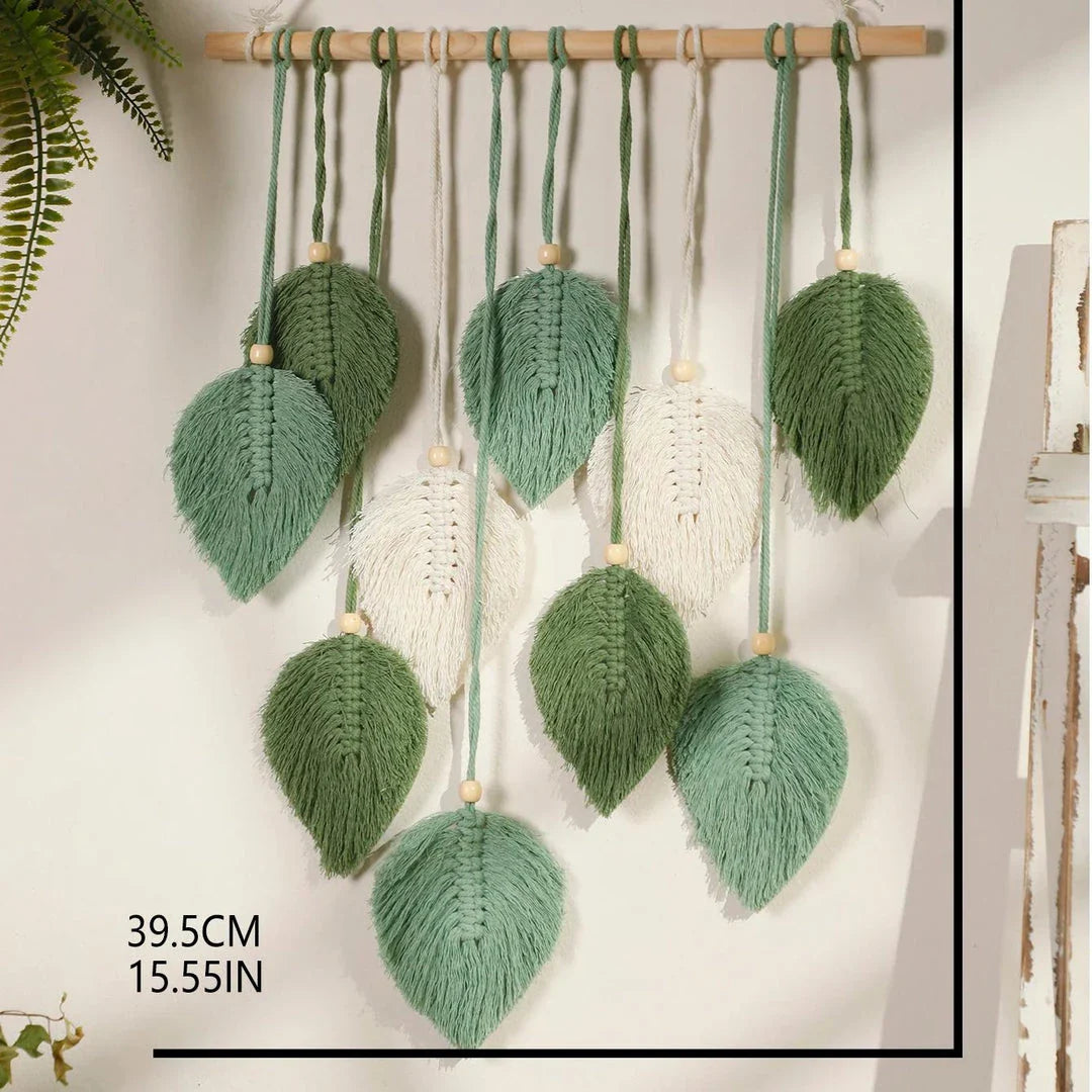 Boho macrame leaf tapestry in earthy tones, featuring elegant leaves and flowing tassels for a cozy, nature-inspired decor piece