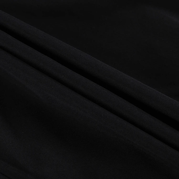 Black and white color-blocked dress with long sleeves and a doll collar, showcasing a timeless and sophisticated style.