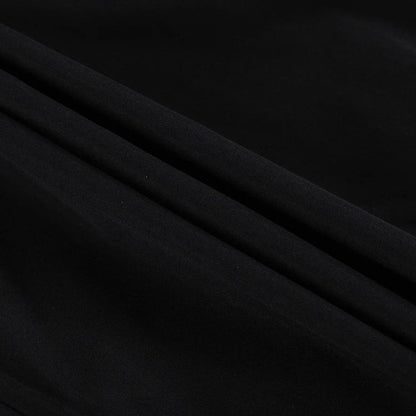 Black and white color-blocked dress with long sleeves and a doll collar, showcasing a timeless and sophisticated style.