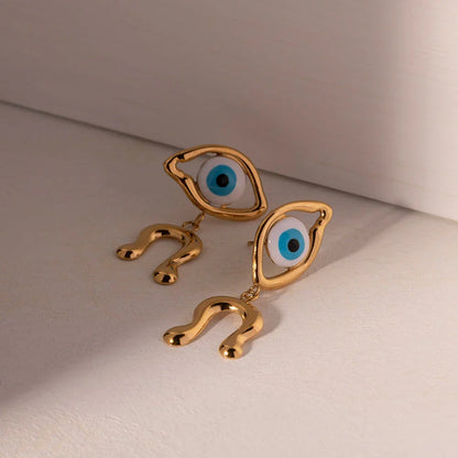 Pair of 18K gold plated stainless steel asymmetrical devil's eye earrings with a dripping oil finish