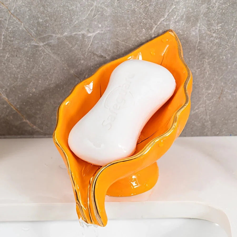 Elegant ceramic leaf-shaped soap dish with a heart design, perfect for adding a touch of nature-inspired luxury to your bathroom decor